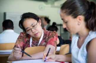 Two people looking at a document