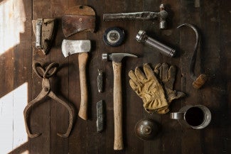Old fashioned tools on a timber work bench