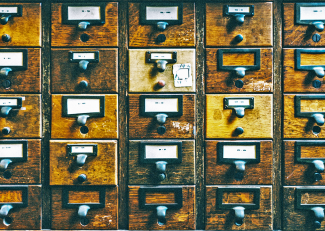 close up of wooden drawers in a 5x5 grid