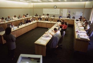 instructor-speaking-to-students-in-classroom_w725_h488.jpg